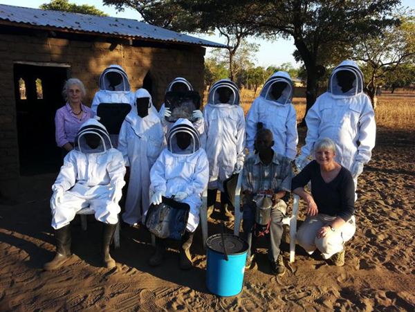Beekeeping team in new bee suits