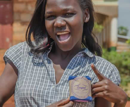 Susan, a co-founder and board member of Irise Uganda Ltd poses with the product