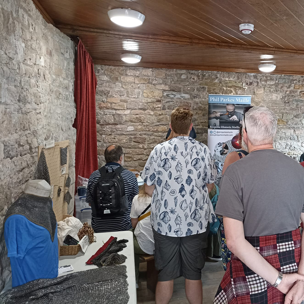 a full audience for maille making demonstrations at chepstow castle