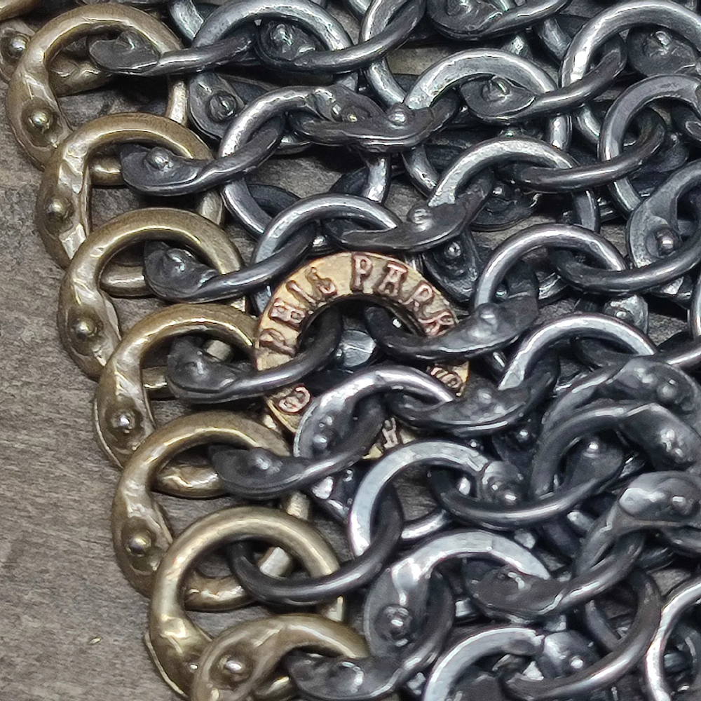 Close up of rings showing brass makers ring and details of wedge-shaped overlap