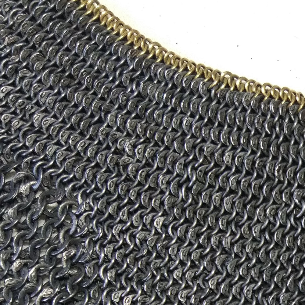 Reverse of standard showing wedge rivets in rings close up